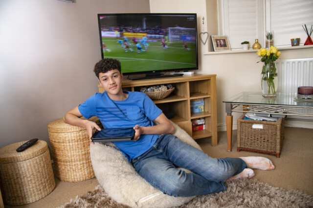 22/03/2023 For Features: 14 year-old Elijah Dallen of Coventry, who watches TV and iPad in a 50/50 split - he still likes telly for sports events. For panel on children's telly habits for HOAR. Pic by Paul Tonge 07757 699788. Commissioned by HOAR.