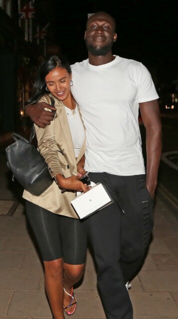 PICTURE BY GARY STONE. 23/7/2019. GRIM ARTIST STORMZY LEAVES THE IVY CAFE IN WIMBLEDON WITH HIS GIRLFRIEND MAYA JAMA THIS EVENING.