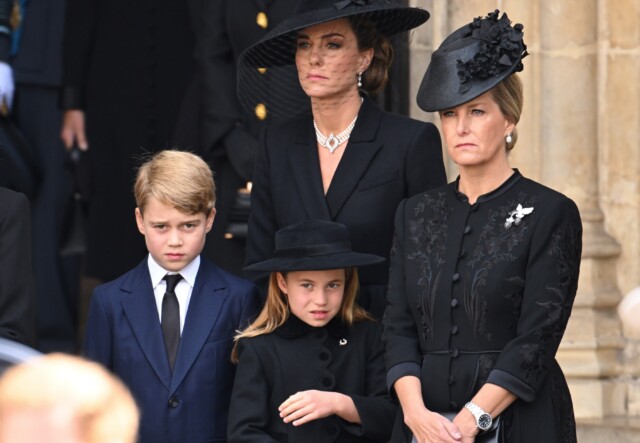 LONDON, ENGLAND - SEPTEMBER 19: (L-R) Meghan, Duchess of Sussex, Camilla, Queen Consort, Prince George of Wales, Catherine, Princess of Wales, Princess Charlotte of Wales and Sophie, Countess of Wessex during the State Funeral of Queen Elizabeth II at Westminster Abbey on September 19, 2022 in London, England. Elizabeth Alexandra Mary Windsor was born in Bruton Street, Mayfair, London on 21 April 1926. She married Prince Philip in 1947 and ascended the throne of the United Kingdom and Commonwealth on 6 February 1952 after the death of her Father, King George VI. Queen Elizabeth II died at Balmoral Castle in Scotland on September 8, 2022, and is succeeded by her eldest son, King Charles III. (Photo by Karwai Tang/WireImage)