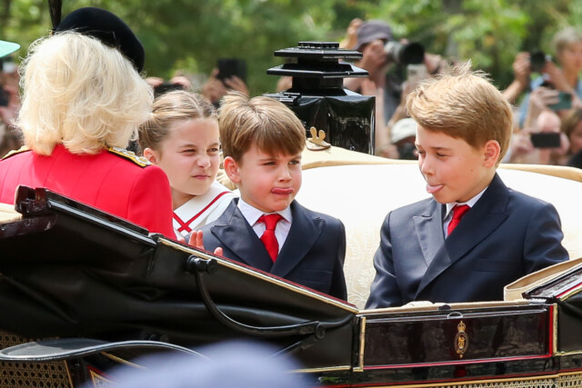 © Licensed to London News Pictures. 01/01/2023. London, UK. Princess Charlotte watches Prince Louis and Prince George stick their tongues out as they make their way to Buckingham Palace from Horse Guards Parade after the Trooping the Colour ceremony in central London. Photo credit: London News Pictures