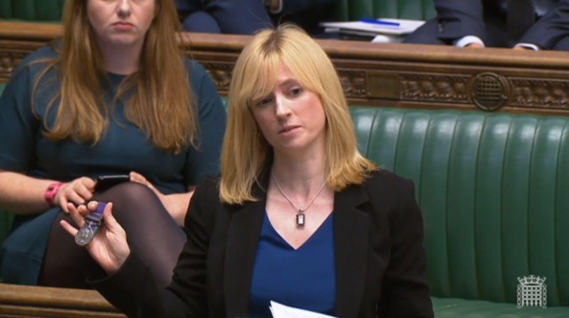 2D34W2X Labour MP for Canterbury, Rosie Duffield, holds up a medal from one of her constituents in the House of Commons in London.
