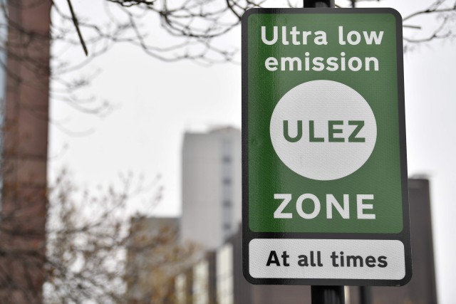 (FILES) New signs for the ultra-low emission zone (Ulez) are pictured in central London on April 8, 2019. A UK court on July 4, 2023, will consider the legality of contentious plans to extend London's road-charging scheme for more polluting vehicles, as opponents engage in protests against it -- and even sabotage. The High Court case comes less than two months before London Mayor Sadiq Khan's expansion of the Ultra-Low Emission Zone (ULEZ) is set to take effect. The scheme -- first introduced in 2019, and separate from the city's two-decades-old congestion charge -- requires more polluting vehicles to pay a £12.50 ($16) toll on days they are driven within inner London. (Photo by Ben STANSALL / AFP) (Photo by BEN STANSALL/AFP via Getty Images)