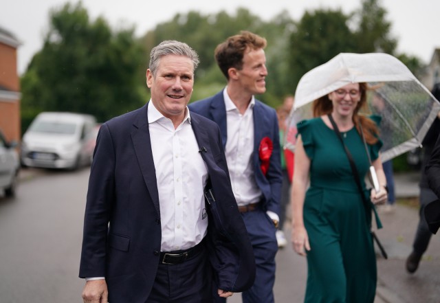 Labour leader Sir Keir Starmer (left) and deputy Labour Party leader Angela Rayner with Labour candidate Alistair Strathern (centre) during a visit to Shefford in the constituency of Mid Bedfordshire, where the sitting MP is former culture secretary Nadine Dorries, ahead of a potential by-election. Picture date: Saturday July 22, 2023. PA Photo. See PA story POLITICS ByElections. Photo credit should read: Jacob King/PA Wire