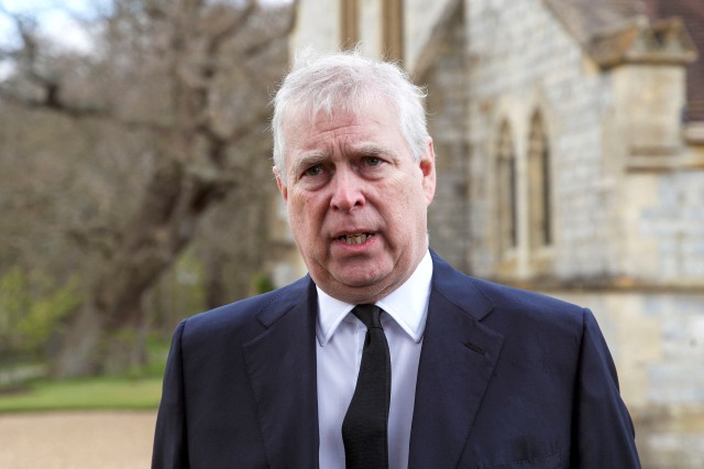 FILE PHOTO: Britain's Prince Andrew speaks to the media during Sunday service at the Royal Chapel of All Saints at Windsor Great Park, Britain following Friday's death of his father Prince Philip at age 99, April 11, 2021. Steve Parsons/PA Wire/Pool via REUTERS/File Photo